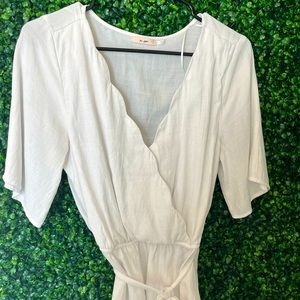 Francesca’s “wrap top” with scallop design on neckline